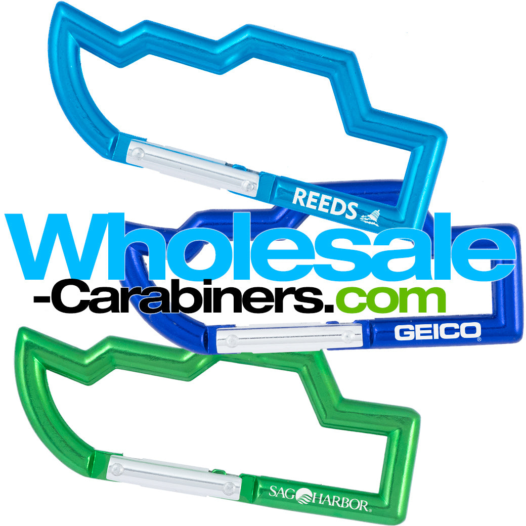 Aluminum engraved carabiners in the shape of a boat, anodized in light blue, dark royal blue, and green.