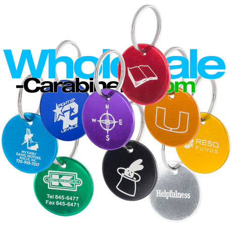 Group shot of nine round customized dog tag medallions in light blue, dark royal blue, green, gold, orange, red, purple , silver and black arranged against a white background.