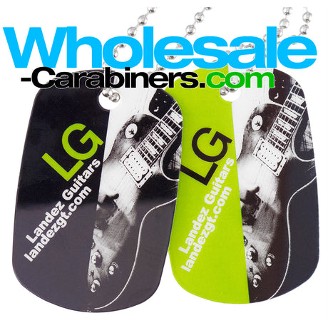 Close up of two full color Teslin dog tags for people, with custom graphics in black and green, viewed straight on, against a white background.