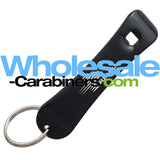 A black snowboard shaped bottle opener keychain with a silver split ring, shown on a white background with a large 'Wholesale-Carabiners.com' watermark overlay.