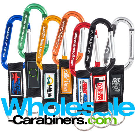 Seven 60mm engraved carabiners all in different colors with attached nylon straps with various customized PVC patches applied.