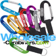 Promotional LogoBeeners, with engraved logos, in nine different colors, with a nylon stap applied to each.
