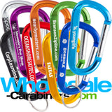 Face on grouping of nine 3.125" (80mm)  carabiners bulk engraved with logos, in colors of light blue, dark blue, green, black, gold, orange, red,  purple and silver, arranged against a white background.