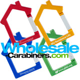 Four aluminum engraved carabiners in the shape of a house, anodized in red, dark royal blue, gold and red.