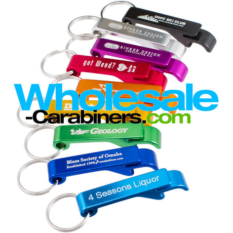 Grouping of nine Pop-a-Top custom engraved anodized aluminum bottle openers that can open flip-top cans also, in light blue, dark royal blue. green, gold, orange, red, silver, purple and black against a white background.