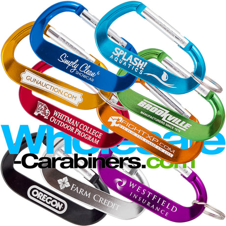 Group shot of nine 3.125" (80mm) engraved anodized aluminum promotional LogoBeener™ carabiners with logos, in colors of light blue, dark blue, green, black, gold, orange, red,  purple and silver, arranged against a white background.